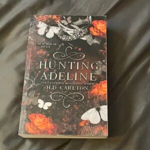 'Hunting Adeline' Book with Orange and Black Cover